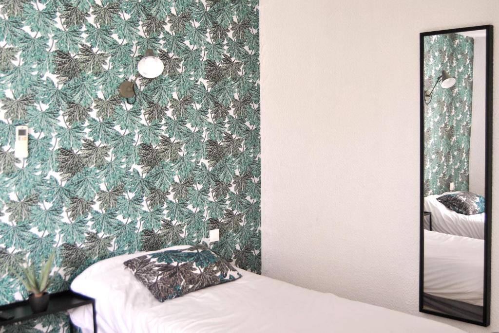 Postel nebo postele na pokoji v ubytování Hôtel le Thurot