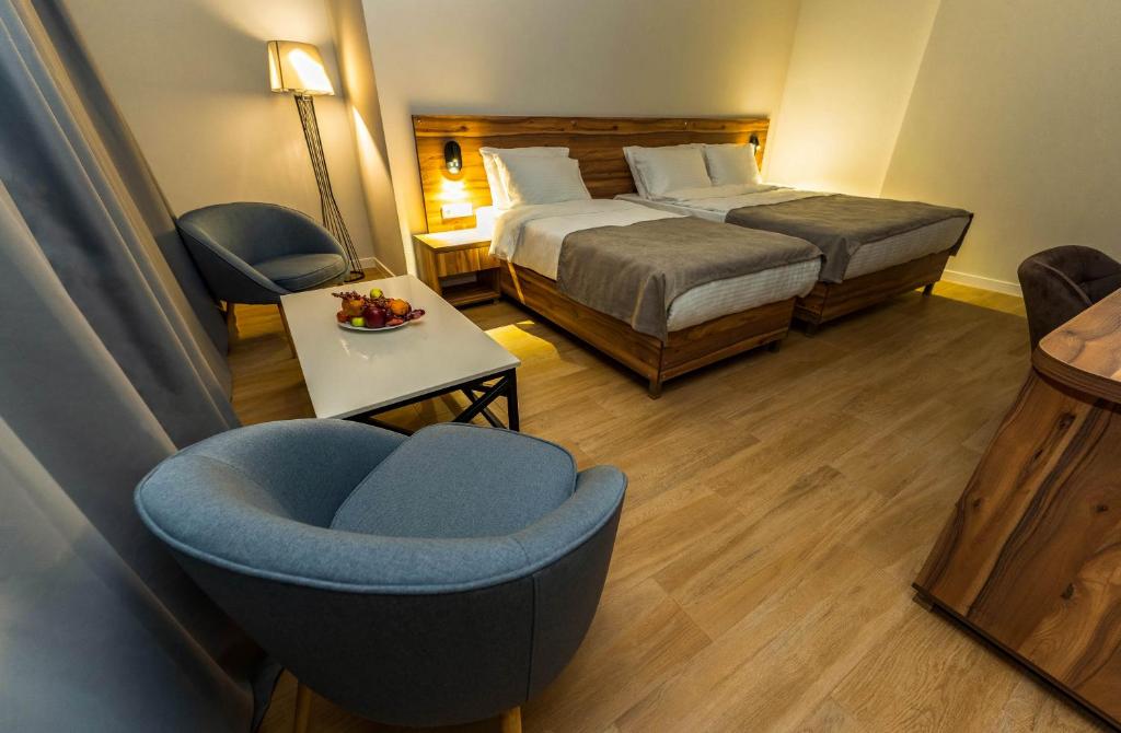 Postel nebo postele na pokoji v ubytování Address Boutique Hotel