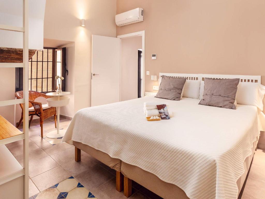 Posteľ alebo postele v izbe v ubytovaní Apartamentos Plaza Mayor 35