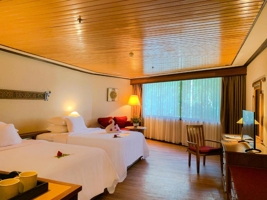 Postel nebo postele na pokoji v ubytování Damai Beach Resort