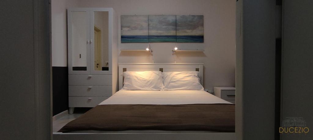 Postel nebo postele na pokoji v ubytování DUCEZIO rooms