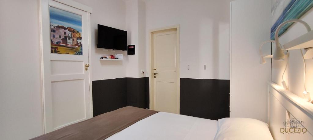 Postel nebo postele na pokoji v ubytování DUCEZIO rooms
