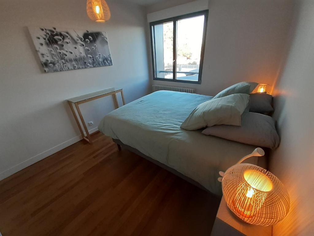 Postel nebo postele na pokoji v ubytování Villa Jules Petit Gîte