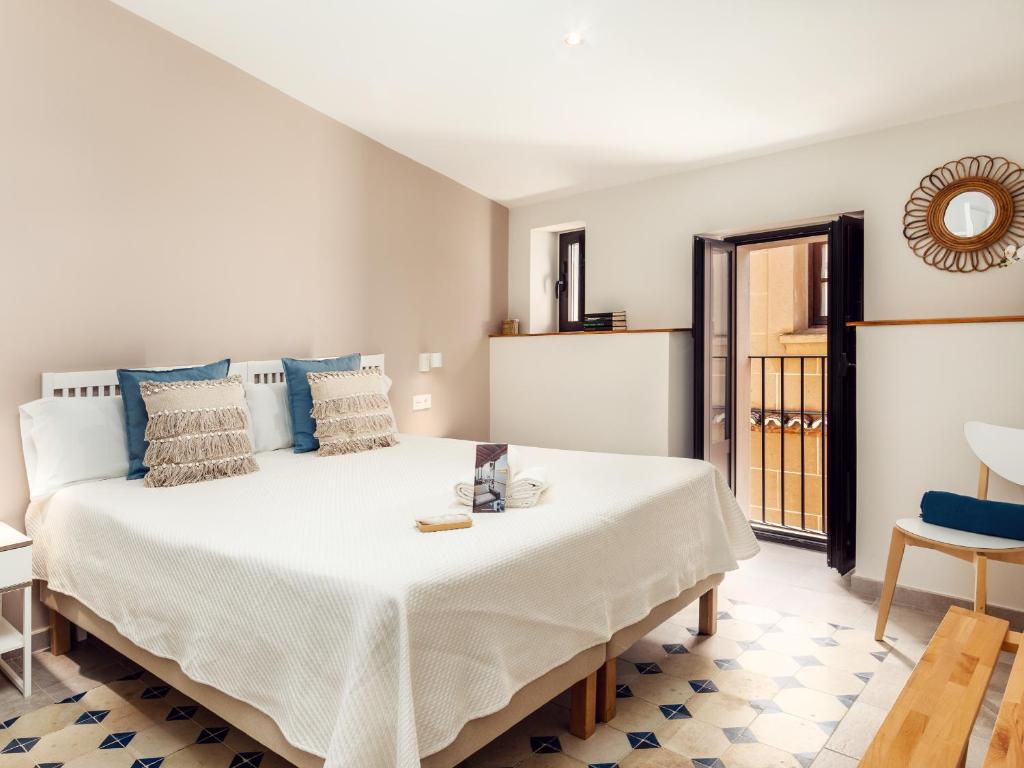 Posteľ alebo postele v izbe v ubytovaní Apartamentos Plaza Mayor 35