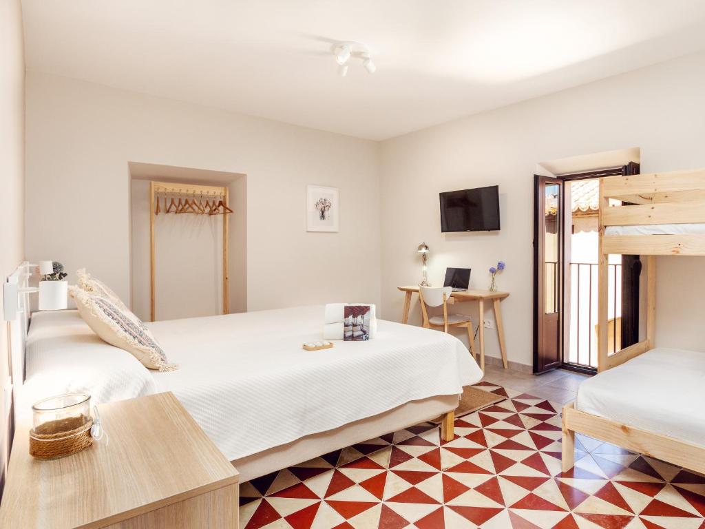 Posteľ alebo postele v izbe v ubytovaní Apartamentos Plaza Mayor 35