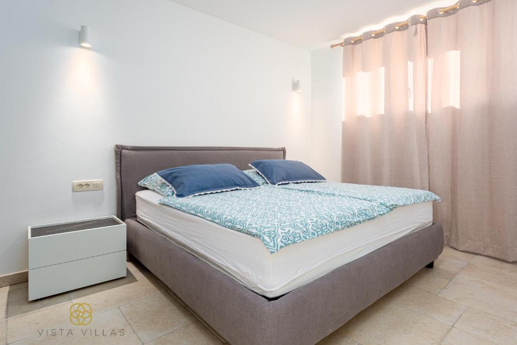 Posteľ alebo postele v izbe v ubytovaní Vista Villas - Lazy Days Apartment Villa N
