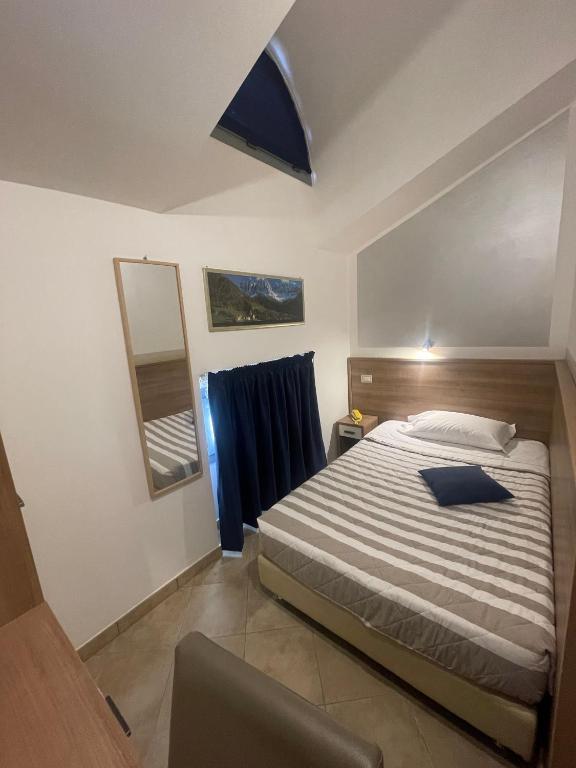 Postel nebo postele na pokoji v ubytování Hotel Montecarlo
