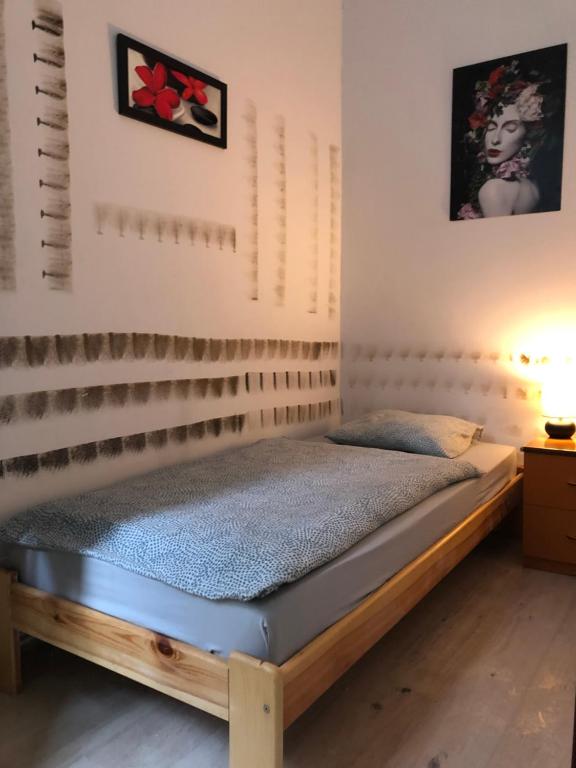 a bedroom with a wooden bed in a room at Nr 3 in Krakow