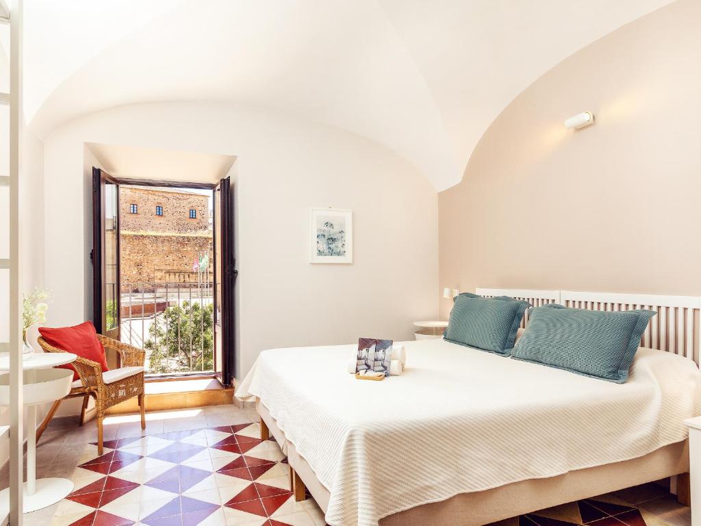 Posteľ alebo postele v izbe v ubytovaní Apartamentos Plaza Mayor 35