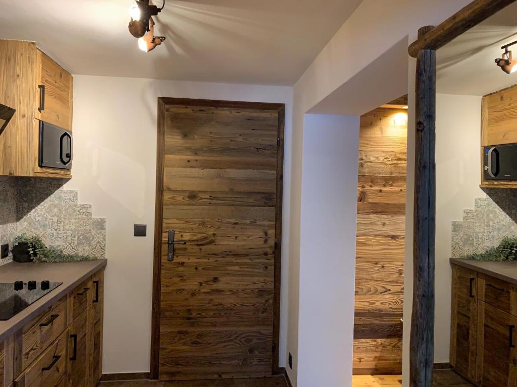 Kuchyň nebo kuchyňský kout v ubytování Chalet Apart Hansler
