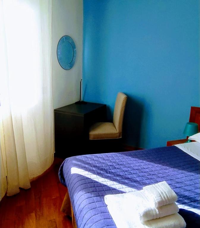 Postel nebo postele na pokoji v ubytování Bed and Breakfast La Villa AMBIENTI SANIFICATI CON GENERATORE DI OZONO