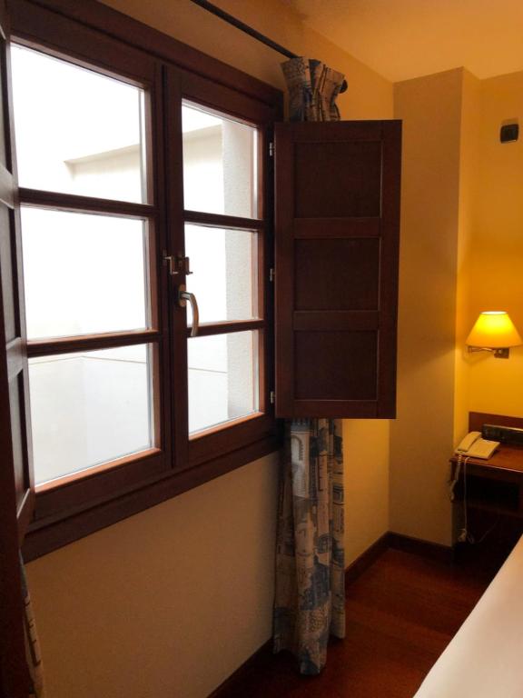 Postel nebo postele na pokoji v ubytování Hotel Aroi Bierzo Plaza