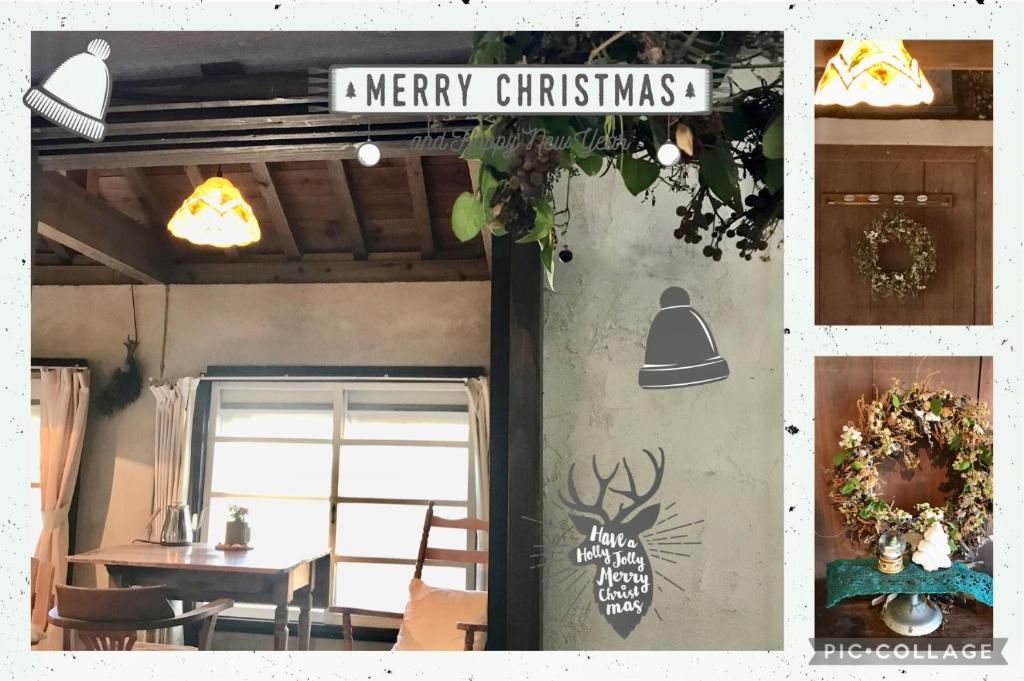a restaurant with a christmas sign on the wall at Travelers House おーさんてぃん青空舎 in Taketomi