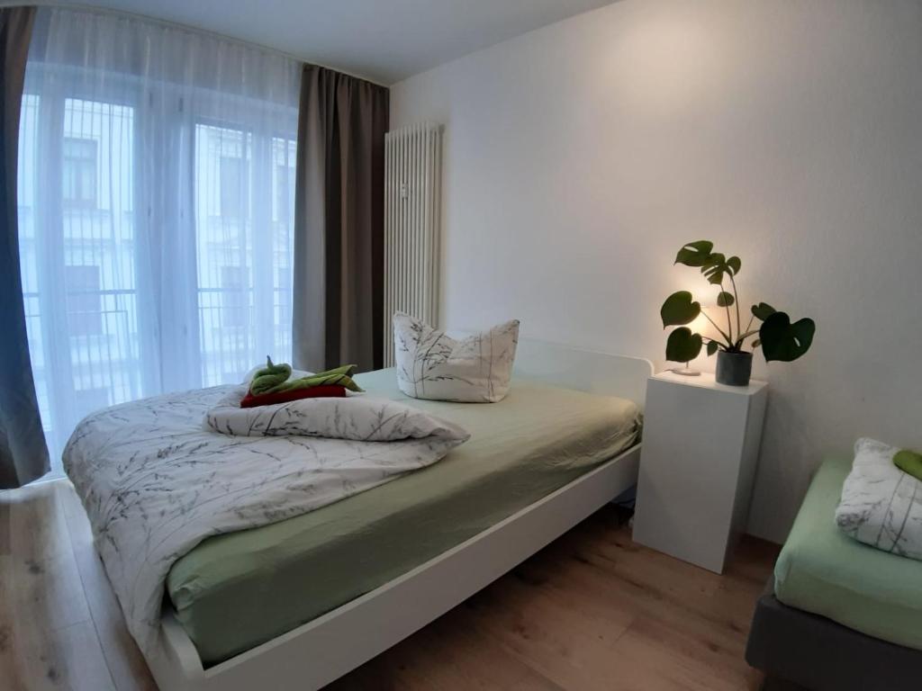 Ένα ή περισσότερα κρεβάτια σε δωμάτιο στο LEA Apartment Zentrum Nord