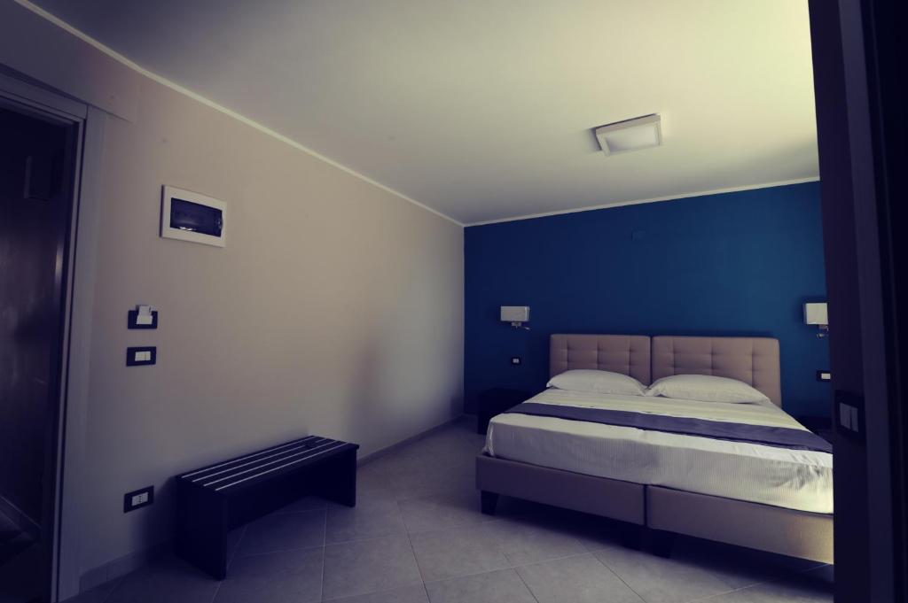 En eller flere senge i et værelse på Guest House San Domenico