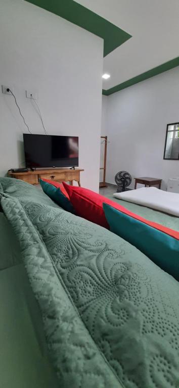 Un pat sau paturi într-o cameră la Pousada Recanto da Lu