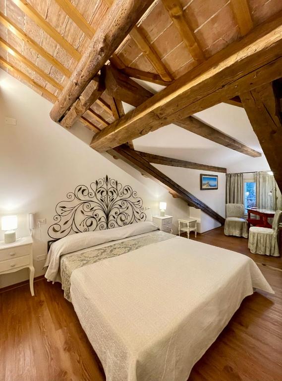 Postel nebo postele na pokoji v ubytování Ca' Settecento "Villa Cavazza Querini"