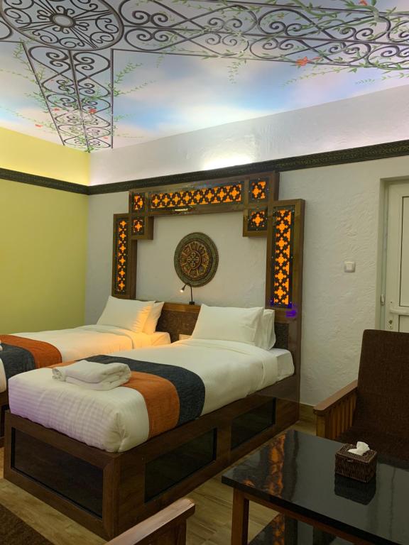 Postel nebo postele na pokoji v ubytování Hotel ABC, Boutique Hotel in Pokhara