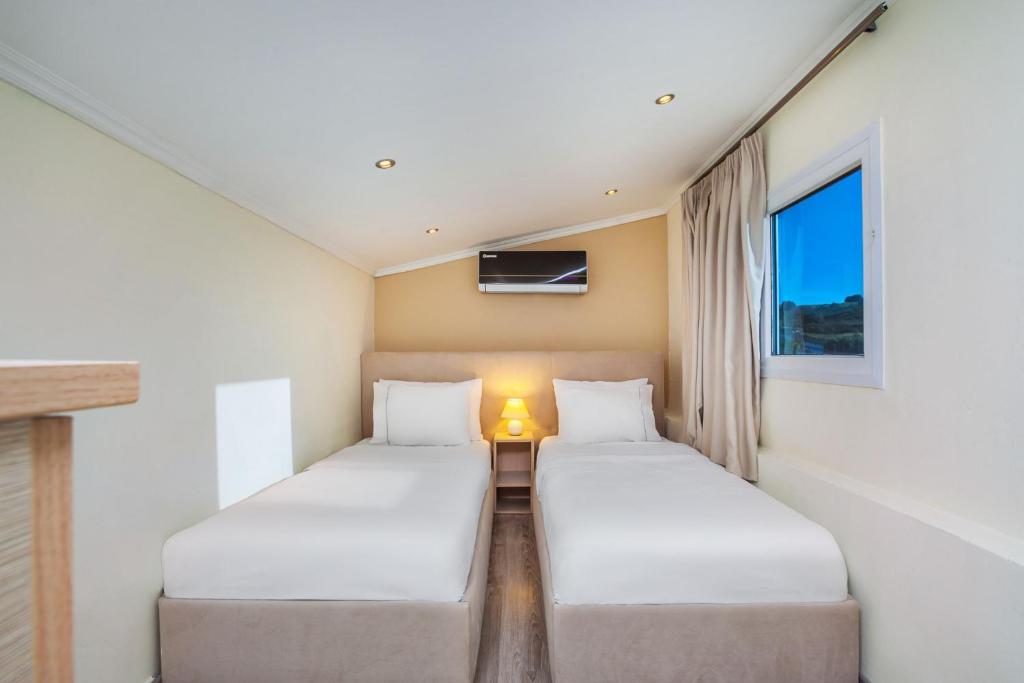 Posteľ alebo postele v izbe v ubytovaní Sunny Villa Grande