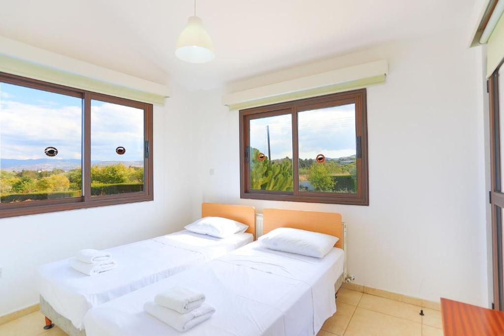 Postel nebo postele na pokoji v ubytování Villa Stavriella