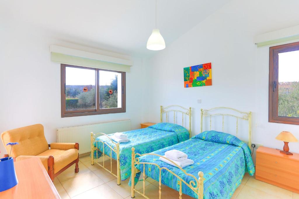 Postel nebo postele na pokoji v ubytování Villa Stavriella
