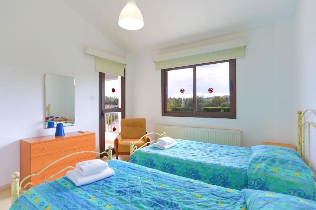 Postel nebo postele na pokoji v ubytování Villa Stavriella
