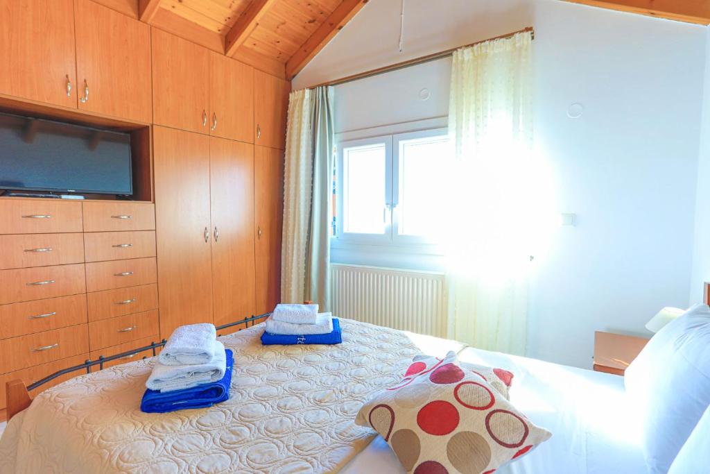 Posteľ alebo postele v izbe v ubytovaní Vista Mare Isavros