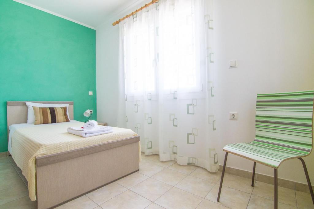 Posteľ alebo postele v izbe v ubytovaní Vista Mare Isavros
