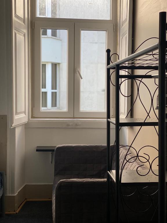 Postel nebo postele na pokoji v ubytování Sri-Indo Guest House