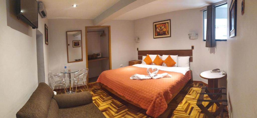 Postel nebo postele na pokoji v ubytování HOTEL AMTALLPA San Blas Inn