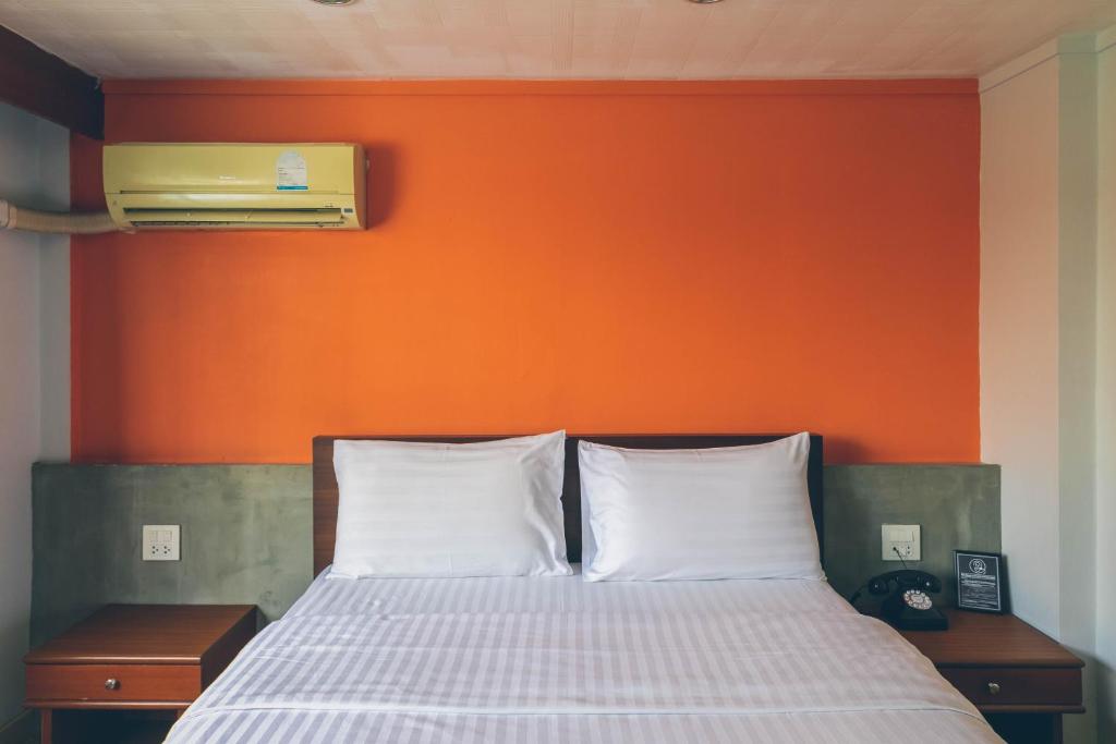 Postel nebo postele na pokoji v ubytování Atlas Bangkok Hotel