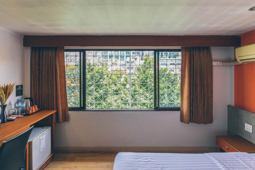 Postel nebo postele na pokoji v ubytování Atlas Bangkok Hotel