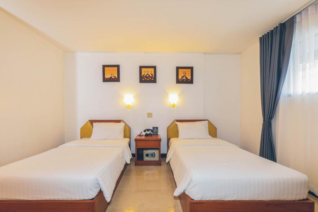 Postel nebo postele na pokoji v ubytování Atlas Bangkok Hotel