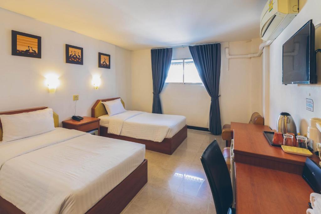 Postel nebo postele na pokoji v ubytování Atlas Bangkok Hotel