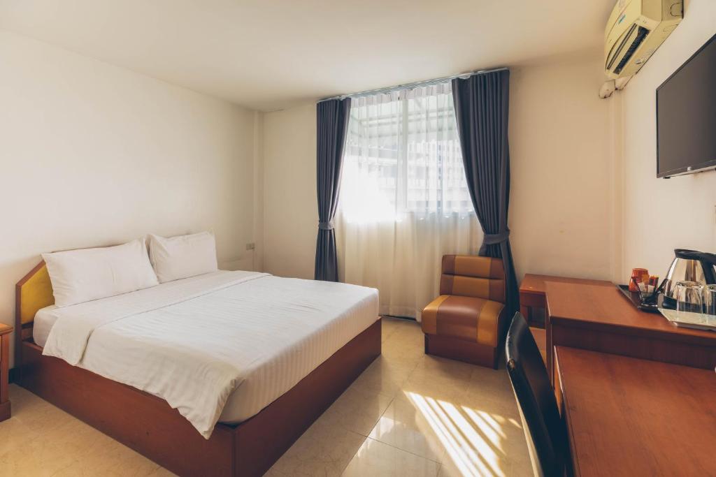 Postel nebo postele na pokoji v ubytování Atlas Bangkok Hotel