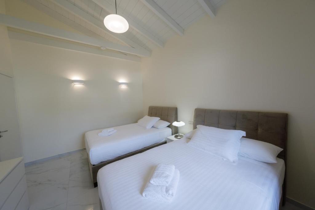 Posteľ alebo postele v izbe v ubytovaní Manazil Mani - Luxury Villas