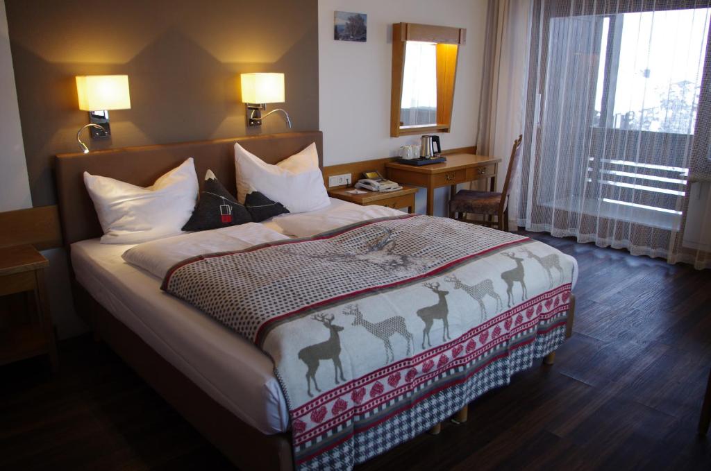 Postel nebo postele na pokoji v ubytování Hotel Löwen
