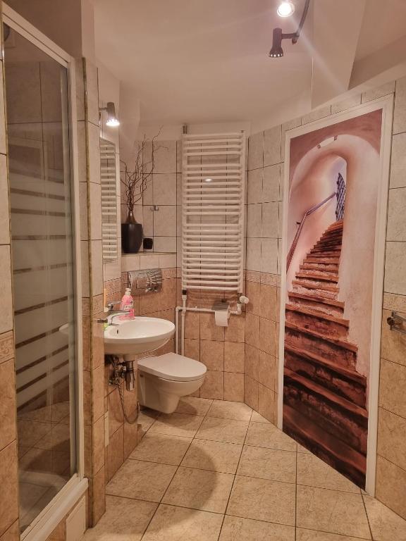 Kúpeľňa v ubytovaní Stylowe poddasze