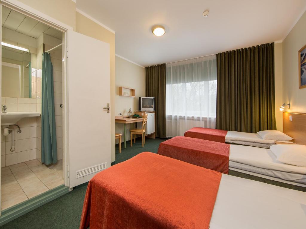 Postel nebo postele na pokoji v ubytování Arabella Hotel