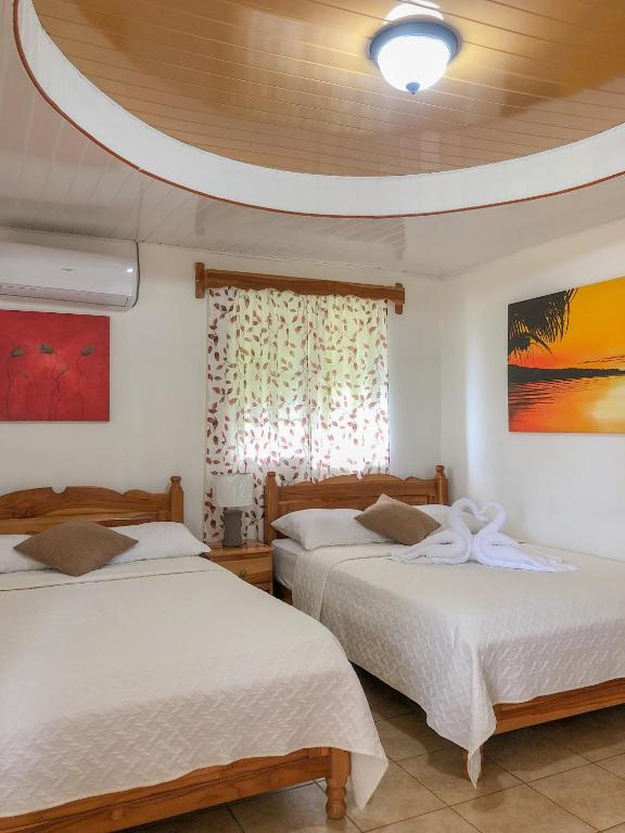 Postel nebo postele na pokoji v ubytování Hostal Familiar Rolo