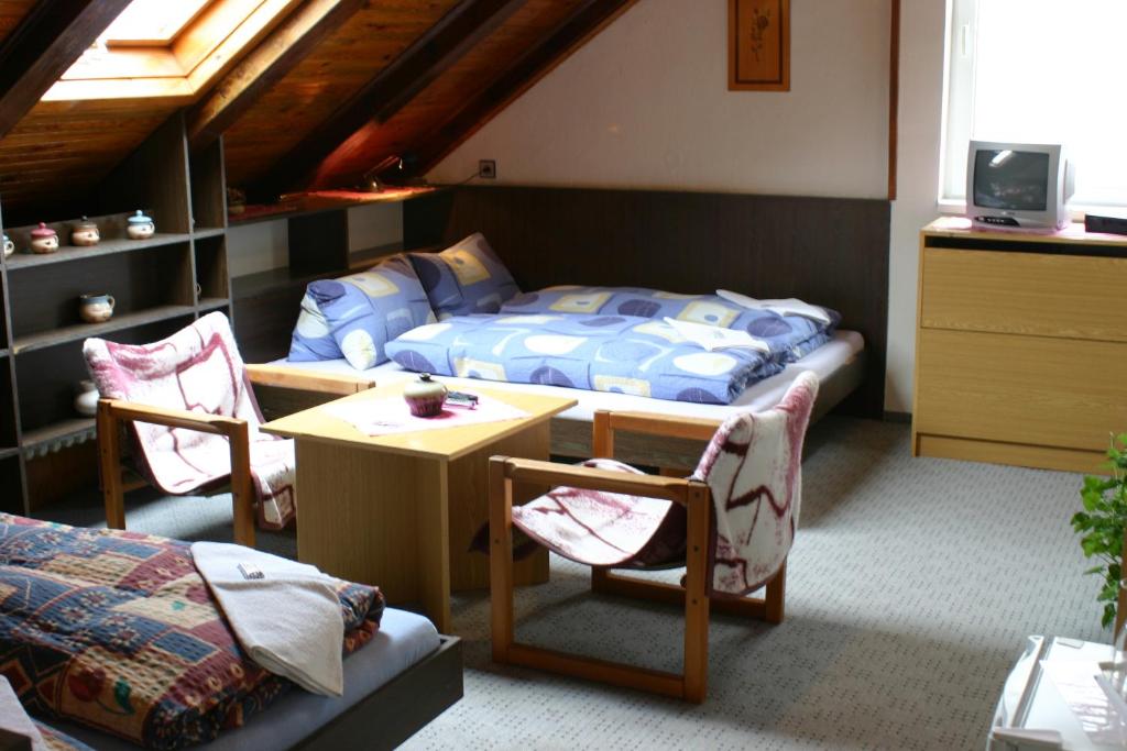 Łóżko lub łóżka w pokoju w obiekcie Pension U Vlášků