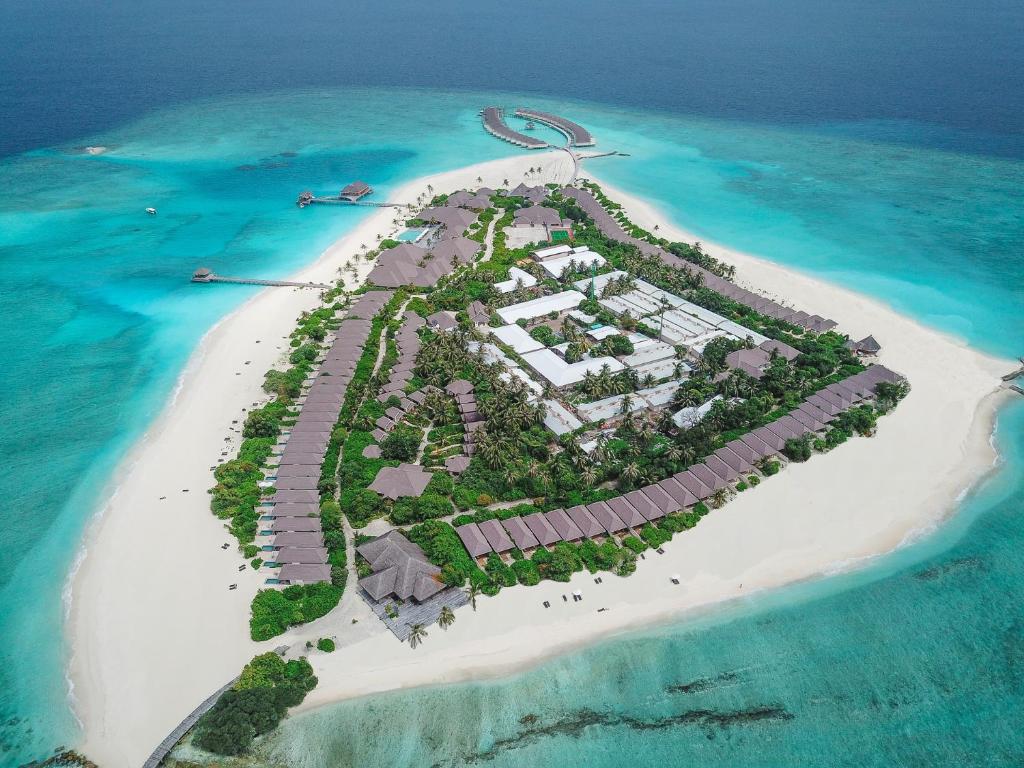 an aerial view of a resort island in the ocean at Brennia Kottefaru Maldives in Raa Atoll