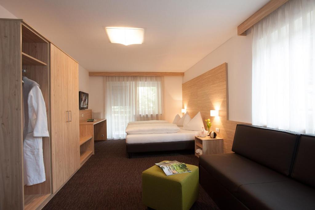 Postel nebo postele na pokoji v ubytování Hotel Stifter