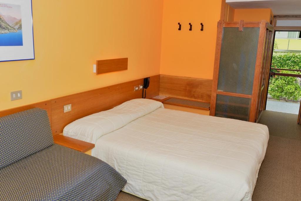 Postel nebo postele na pokoji v ubytování Hotel Lido