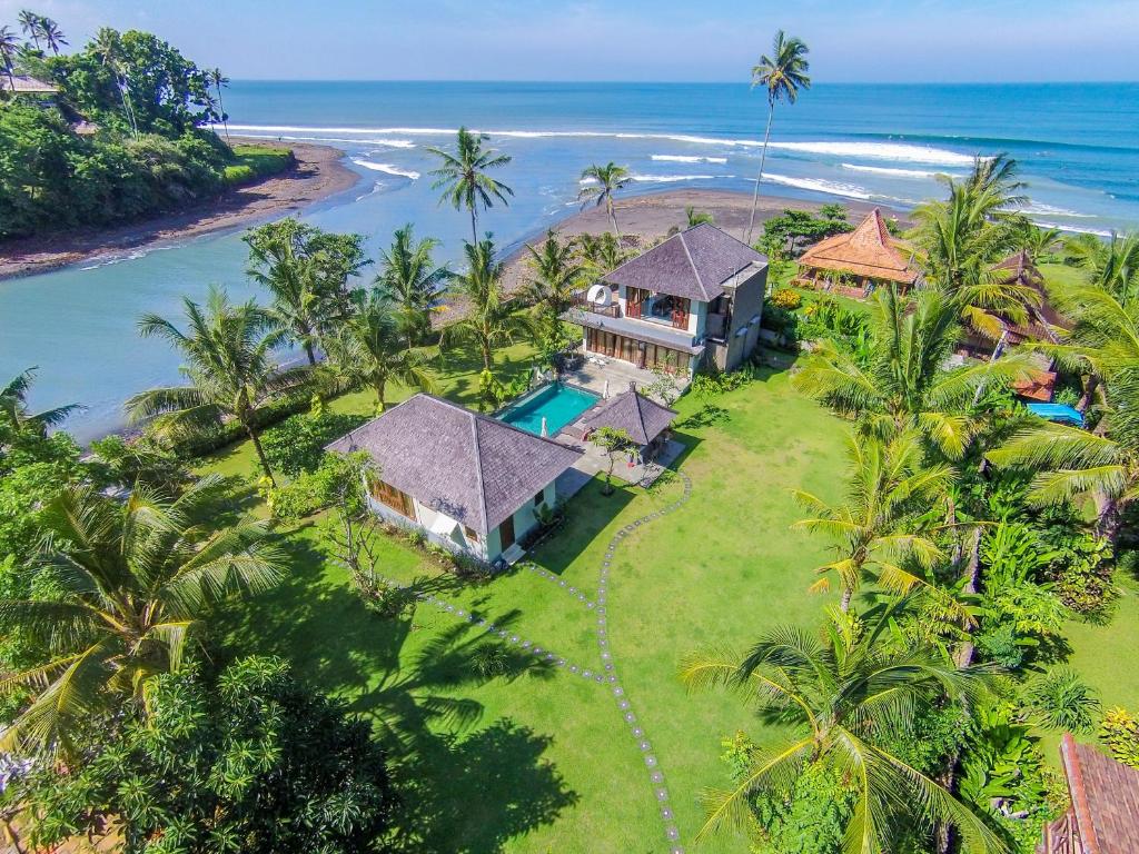 an aerial view of a house and the ocean at Beach Villa Balian in Selemadeg