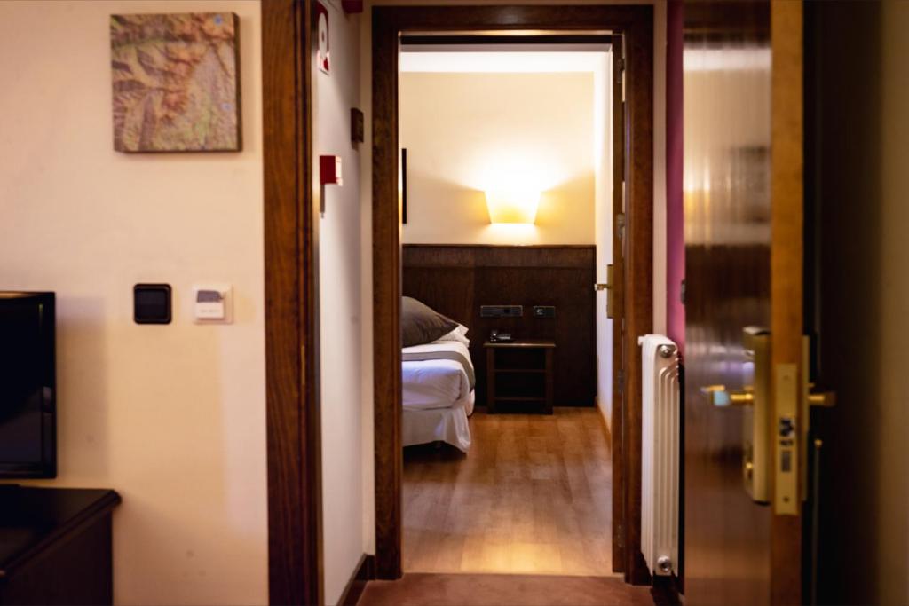 Postel nebo postele na pokoji v ubytování Hotel Valle De Izas
