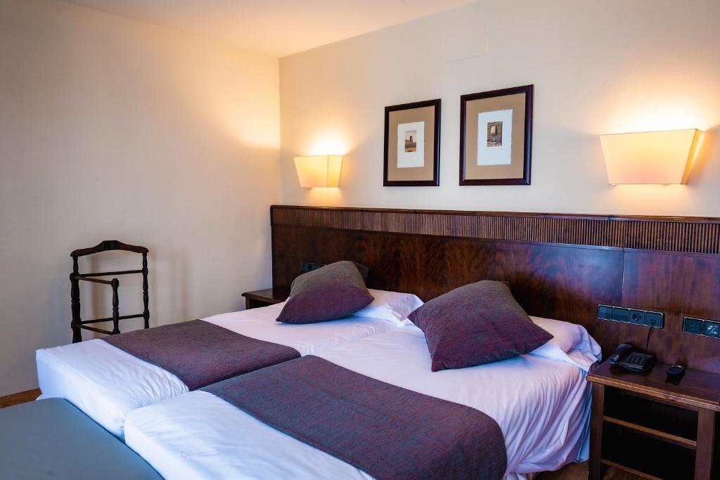 Postel nebo postele na pokoji v ubytování Hotel Valle De Izas