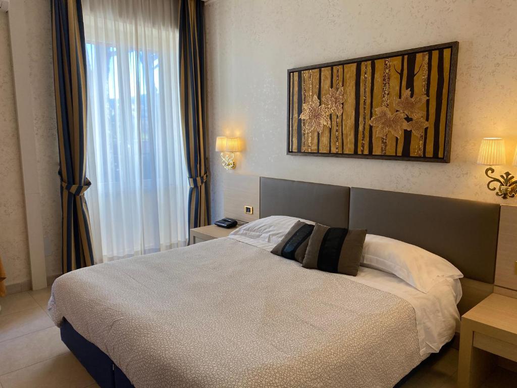 Postel nebo postele na pokoji v ubytování Domus Park Hotel & SPA