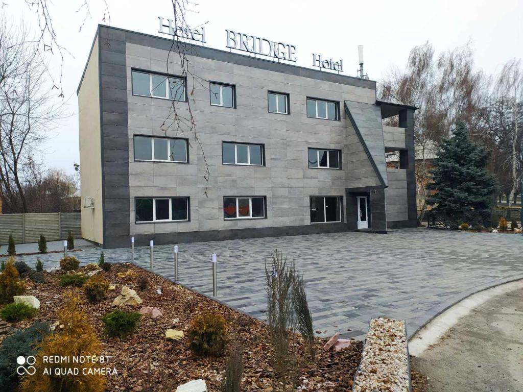 a building with the words surprise hotel on it at Bridge in Kharkiv