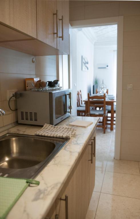 Kuchyň nebo kuchyňský kout v ubytování City apartment